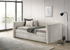 Cama Canguro Molly beige vista lateral en sala moderna con lámpara de pie y ventanal - Estylo House Muebleria