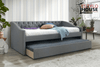 Cama canguro Elegante Loretta tapizada en gris con tachuelas y trundle extraído, en recámara con plantas y tapete de pelo largo - Estylo House Muebleria
