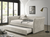Daybed Yuri tapizado en tela color beige con descansabrazos curvos, cama nido extraída, en ambiente de recámara junto a ventanal - Estylo House Muebleria
