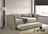 Daybed Yuri tapizado en tela color verde claro con descansabrazos curvos, cama nido extraída, en ambiente de recámara junto a lámpara de piso - Estylo House Muebleria