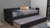 Cama Canguro Sadie con somier extraído, tendida con ropa de cama a rayas y cojines decorativos en tonos mostaza y azul - Estylo House Muebleria
